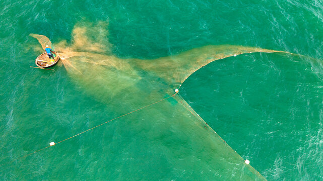 Fishermen Casting Fishing Nets in Chan May Sea, Hue, Vietnam
