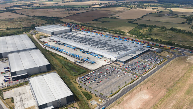 Loversall, United Kingdom - 14 July 2026: Aerial view of IPORT DONCASTER logistics hub featuring large warehouses, rows of shipping containers, and expansive parking areas.