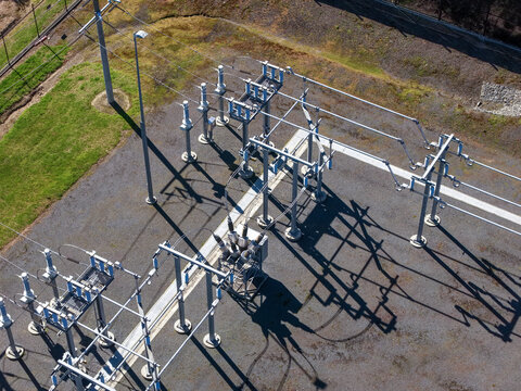 Chirnside Park, Victoria, Australia - 01 September 2026: Aerial view of Chirnside Park Zone Substation, showing electrical infrastructure, transformers, and metal structures casting shadows.