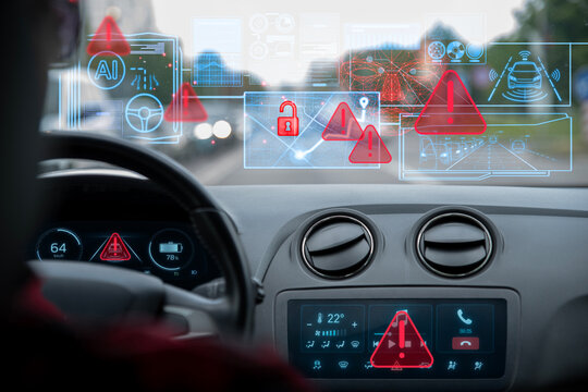 AI-powered autopilot displays security warnings after a hacker remotely accesses the car computer and takes control of the vehicle. Cyberattack, remote vehicle hijacking and cybersecurity risks.