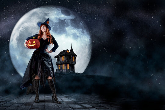 Witch on Halloween. Female wizard fairy character for All Saints' Day. Fantasy gothic red-haired Vampire girl in black dress. Enchantress dressed in carnival costume
