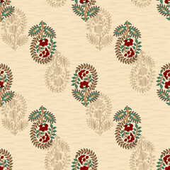 Seamless block-print pattern featuring ethnic paisley mango buttis in crimson red and jade green on a beige textured ground, layered with subtle tonal shadow motifs for classic depth. © KARMA_BELIEVER