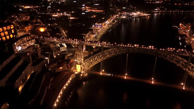 Sweeping Flyover of Porto's Dom Luis I Bridge at Night