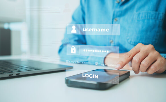 Mobile login authentication with person using smartphone beside laptop to secure account access manage credentials protect personal data and support safe digital connectivity.