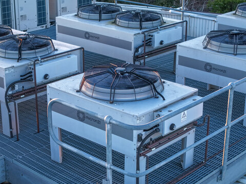 Kilsyth South, Victoria, Australia - 29 August 2026: Aerial view of Micron21 Data Centre rooftop with industrial cooling units and ventilation fans on metal grating.