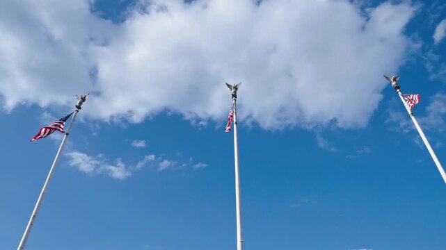 American flag in Washington DC. 4th of July. American flag waving in the wind. Flag of the USA. National waving flag of united states on blue sky. Independence day. Patriotic symbol