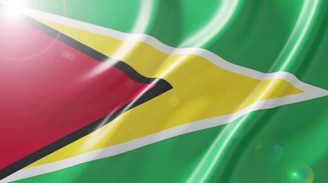Close-up view of the national flag of Guyana waving with a glossy texture and light flares.