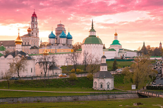 SERGIYEV POSAD, RUSSIA &ndash; May 3, 2025: Trinity Sergius Lavra in Sergiev Posad at sunset. View of the historic monastery complex with golden and blue onion domes, bell tower, and defensive walls.