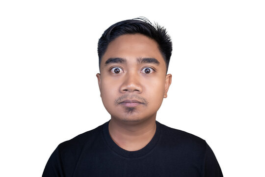 Man stares with wide eyes, expression of surprise. He wears a plain black t-shirt. Simple white background highlights his face. Perfect for humor, reaction, or surprise themes