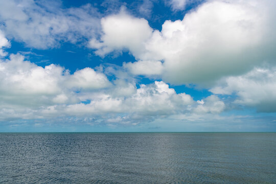 Skyscape with sea horizon. Calm horizon view at sea nature. Romantic summer vacation view on seascape. Caribbean sea. Sea horizon view. Cloudy sky and seascape at summer vacation