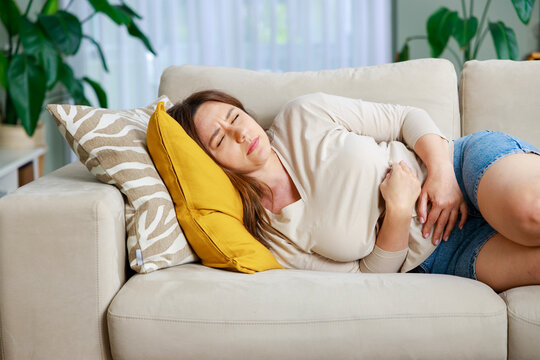 Woman experiencing stomach pain