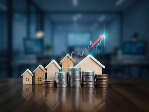 Wooden House Models With Stacks Of Coins And Rising Financial Growth Chart