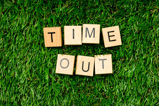 Time out sign on grass