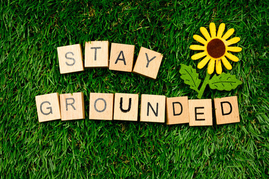 Stay Grounded sign on grass