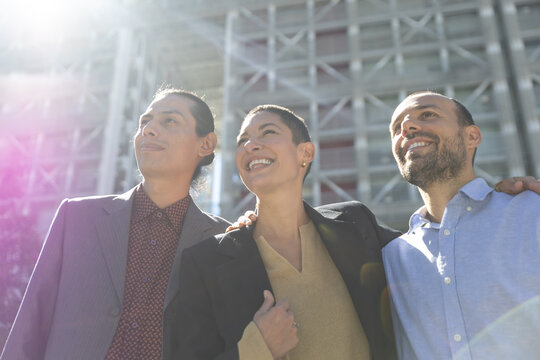 Happy business colleagues share optimism outdoors