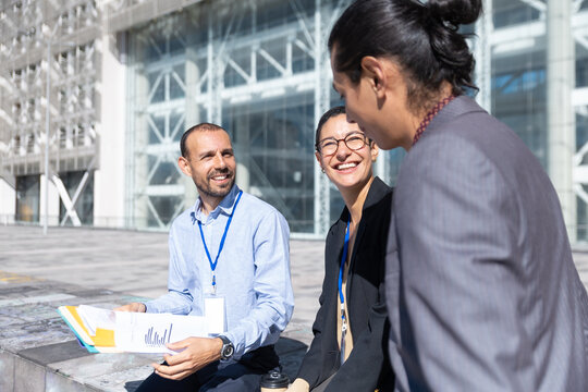 Business colleagues discuss strategy outdoors