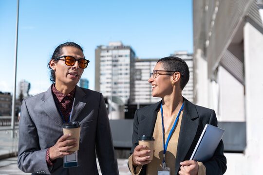 Business colleagues drink coffee and discuss ideas outside the office