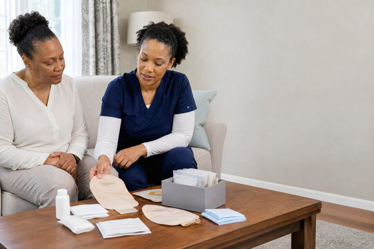 Ostomy Care Education with Healthcare Professional and Patient at Home