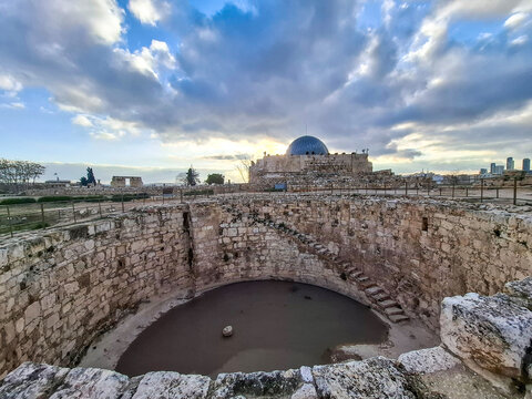 Amman, Jordan - 9 February 2026 : History of ancient Arabic Islamic rule in the Middle East in Amman citadel Hill (Umayyad palace - old mosque)  and Open water tank (pond)