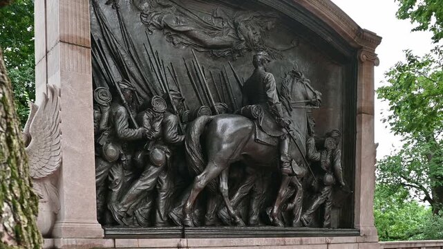 Boston in Massachusetts, USA showcasing the 54th Regiment of the Civil War monument on the entrance of the Boston Commons at Beacon Hill.
