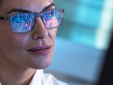 Focused AI engineer designs electronic product indoors