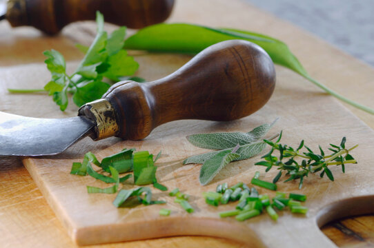 Various herbs on chopping board