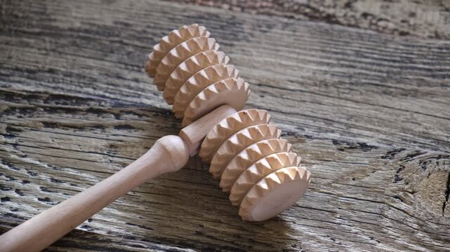 Anti-cellulite self massage with zero waste wooden roller massager.  Anti-Cellulite Massage At Home. Beauty skincare.  Massage madera. Maderotherapy anti cellulite massage treatment with wooden prop
