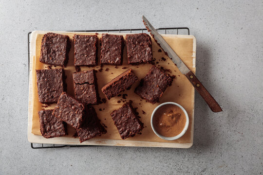 Homemade vegan protein bean brownie rests on a cutting board