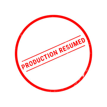 A bright red circular rubber stamp graphic featuring the bold text production resumed isolated on a clean white background for industrial document marking