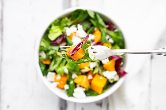 Fork of autumnal salad with feta and Hokkaido pumpkin