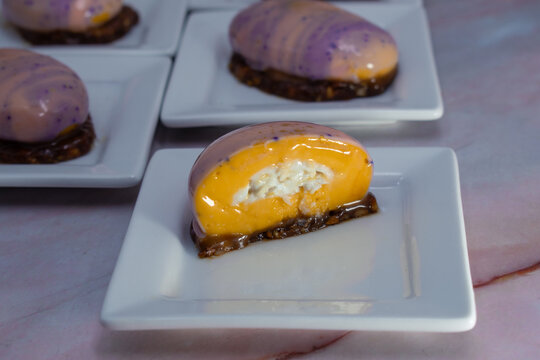 River rock shaped dessert: mango coconut entremets, mini portions. 
