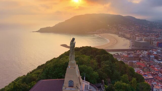 Sunrise drone view of San Sebasti&aacute;n, Basque Country, Spain, famous Jesus Christ statue on a hill in San Sebasti&aacute;n, vacation in northern Spain