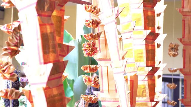 Gold and red joss paper hanging decorations for Ghost Month Cioko ceremony