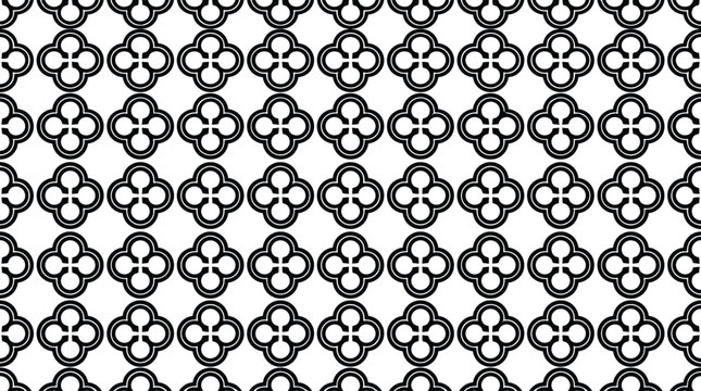 Geometric seamless pattern featuring repeating clover-like quatrefoil shapes in black and white for textile or wallpaper