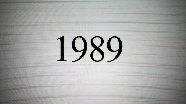 Capture: the year 1989 appearing on a vintage CRT screen. The numbers are typed by a classic pixelated text cursor, creating a retro computing aesthetic.