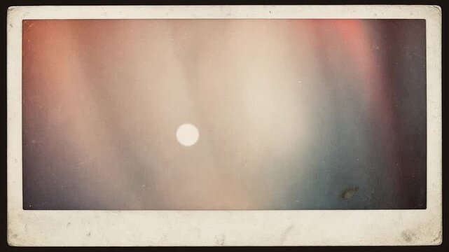 Vintage photo with moving abstract light leaks and film grain creating a nostalgic, retro, and cinematic background animation