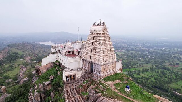 Cinematic drone view of Melkote historical temple and surrounding scenic landscape with heritage beauty