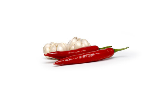 Whole garlic bulb crossed with hot chili peppers
