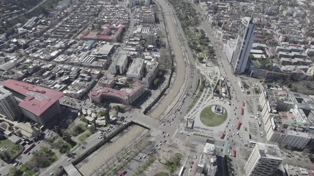 Drone Tilt Up Over Santiago Skyline and Andes Mountain Range from University
