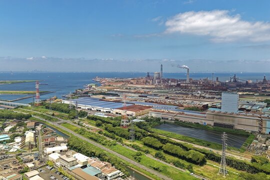 Aerial drone photo of coastal industrial zone with factories and canals in Kimitsu, Chiba, Japan