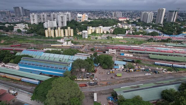 Aerial cinematic view of KSR bangalore city railway junction with trains highlights station infrastructure