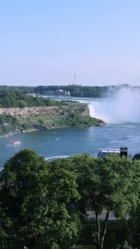 Panoramic view of Niagara Falls and city skyline on sunny day in Ontario Canada. Horseshoe Falls, American Falls and Niagara River