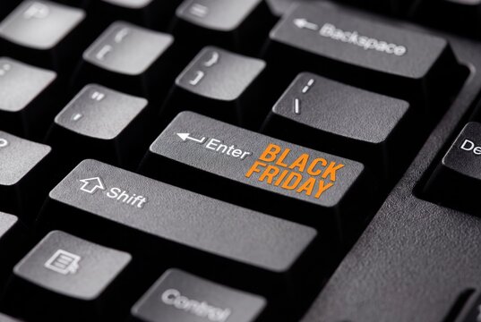 Black Friday text on a computer keyboard enter key for online shopping sales event.