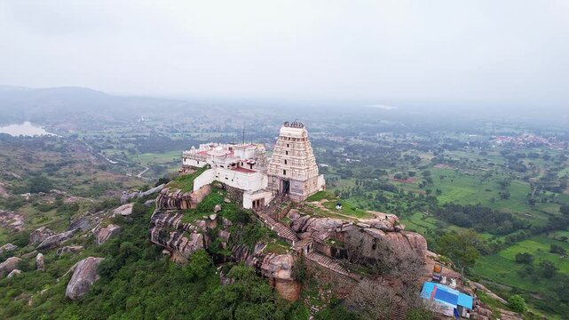 Cinematic drone view of Melkote historical temple and surrounding scenic landscape with heritage beauty
