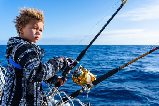 little boy checking his reel