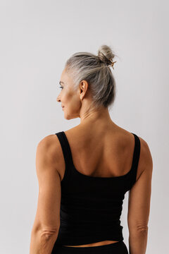 Mature woman with gray hair looking away