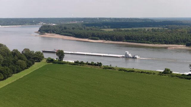 Aerial of barge on Mississippi River in Cairo Illinois on Missouri border at confluence with Ohio River