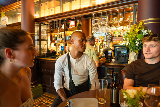 Diverse group socializing in a cozy bar