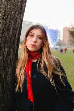 Woman in red scarf at carnival