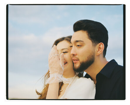 Young Couple Laughing Together in Close-up Portrait